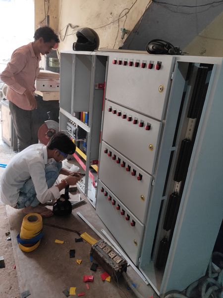 Power distribution panel assembly with busbar chamber