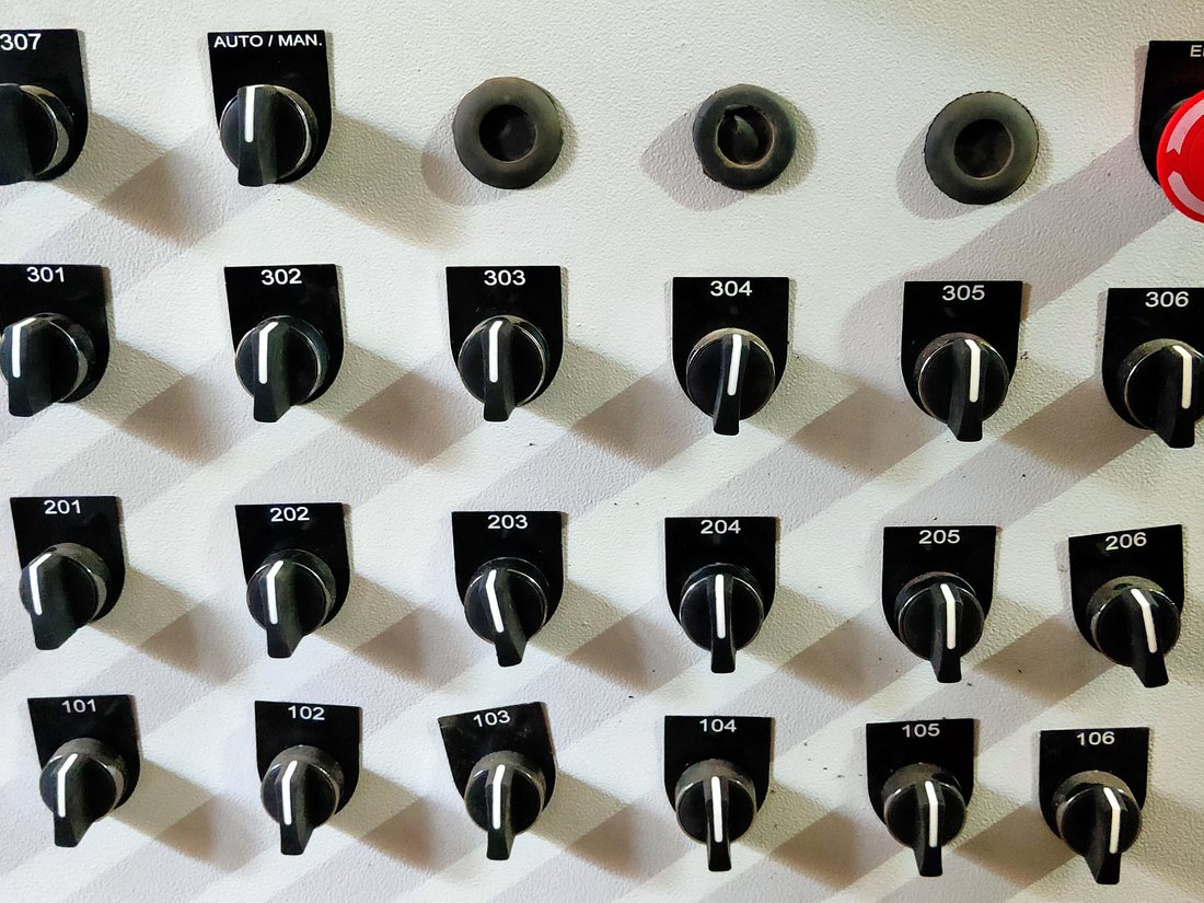 Operator panel with numbered selector switches and emergency stop